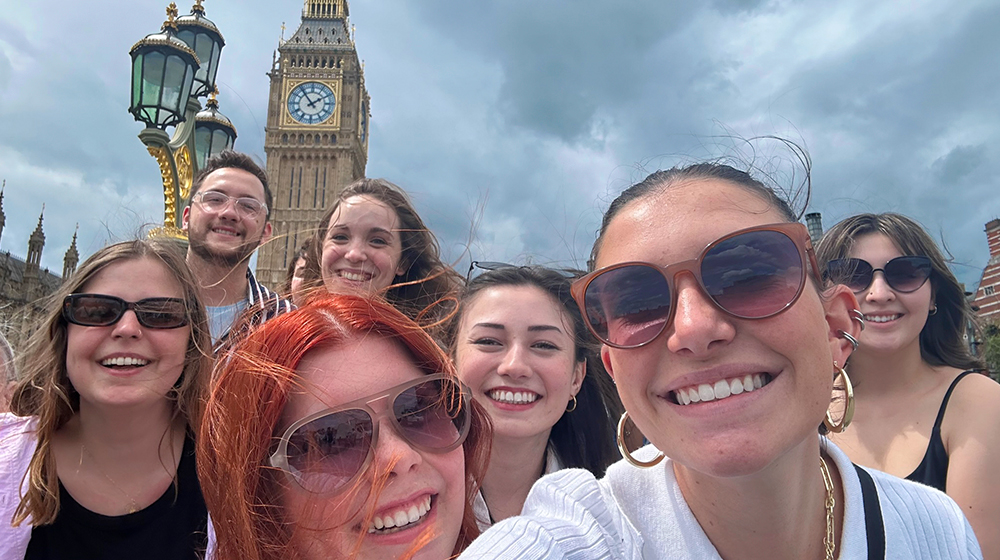 Loyola students taking a selfie in front of Big Ben in London during study abroad