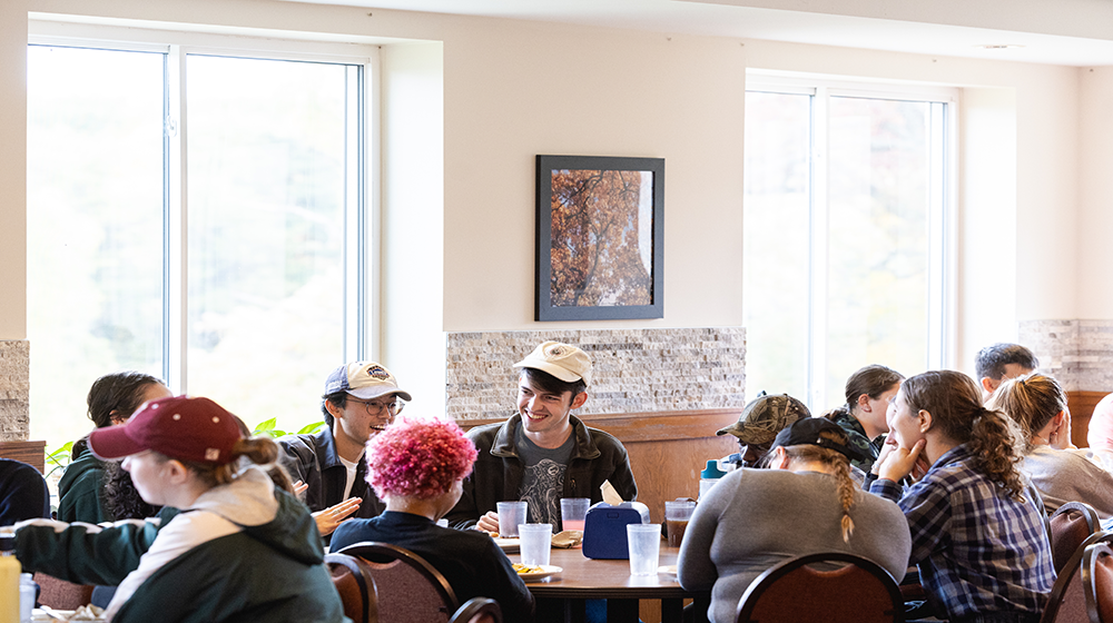 Students laughing at table