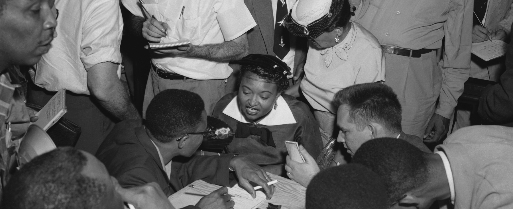 Mamie Till-Mobley talking with a group of reporters.