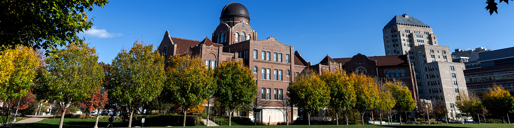 The Loyola Lake Shore Campus Cudahy Science Hall with fall foliage surrounding it