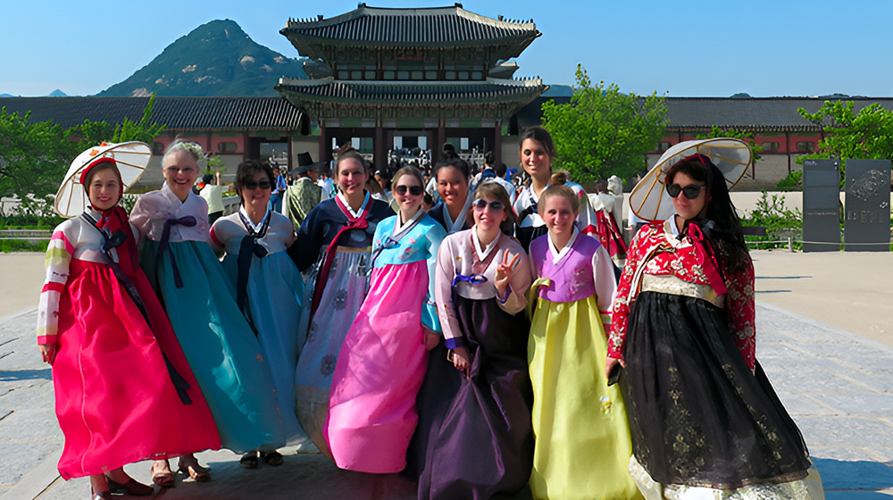 Loyola students stand in front of a temple in South Korea