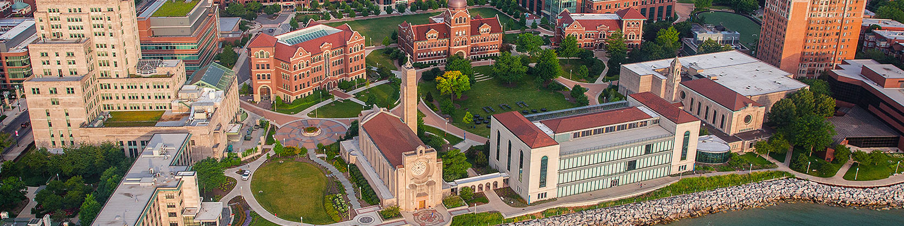 An aerial view of Loyola University Chicago's Lake Shore campus during the golden hour