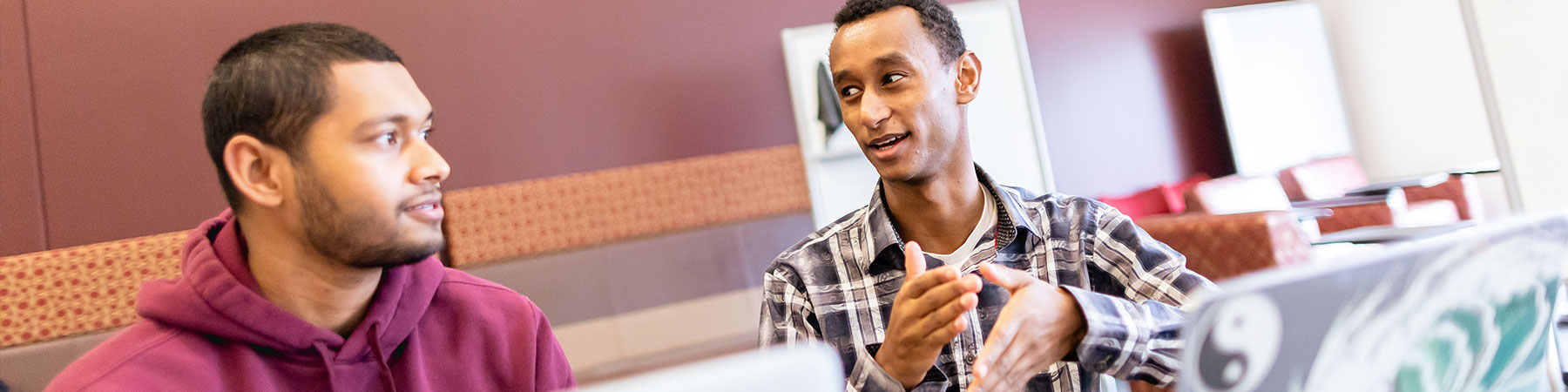 Loyola University Chicago student and mentor interact within the Office of Research Services.